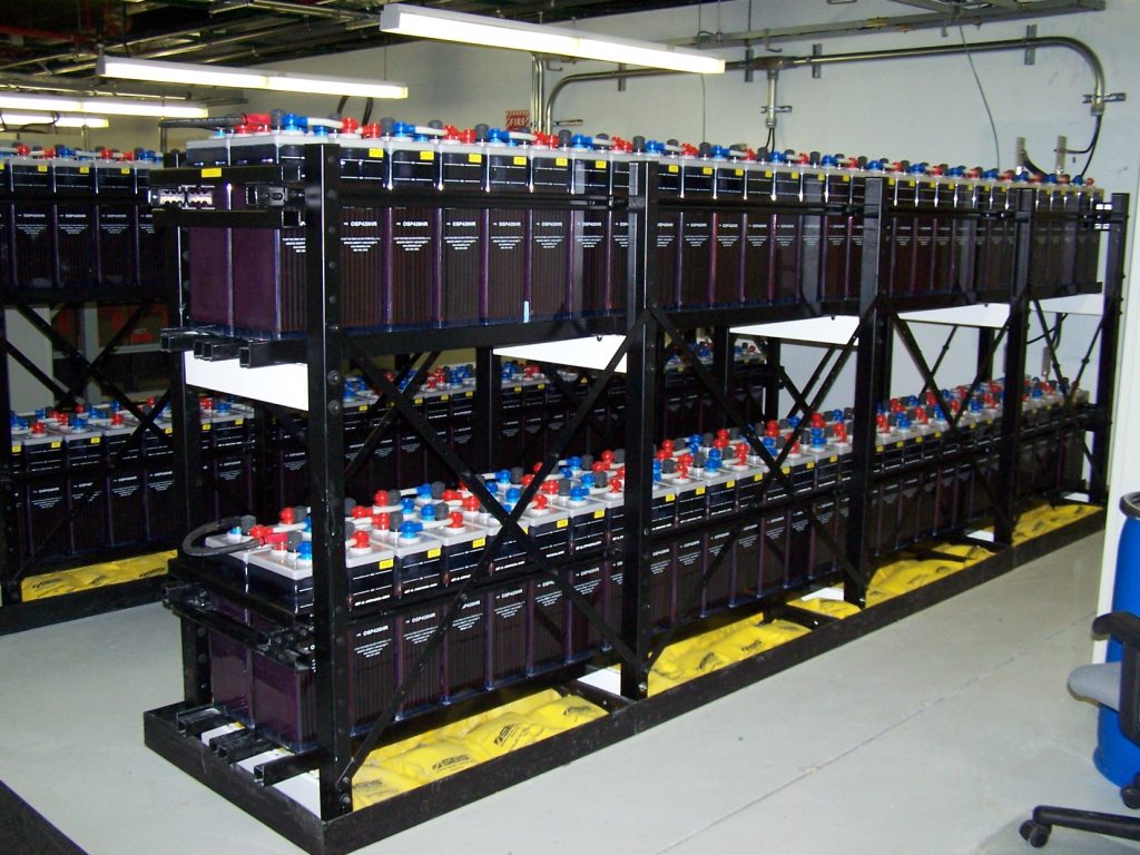 High-capacity 2V industrial batteries providing uninterrupted power backup for a factory.